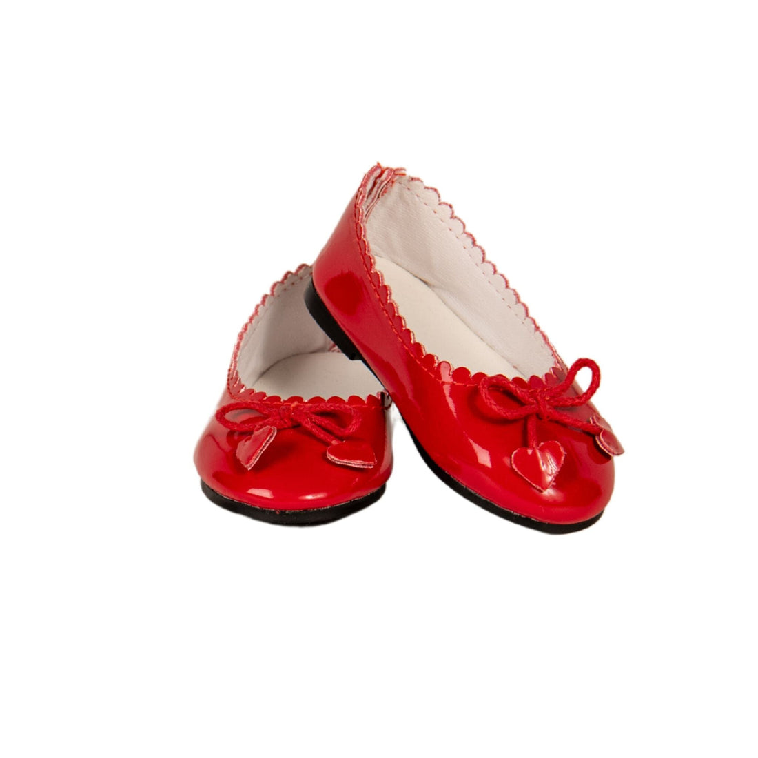 Shiny red shoes with hearts on the ties