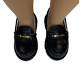 detail image of Kensington chunky black loafers with gold star chain on maplelea doll.