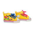 Bright yellow high top runners for dolls are embroidered with colourful flowers and buzzing bee