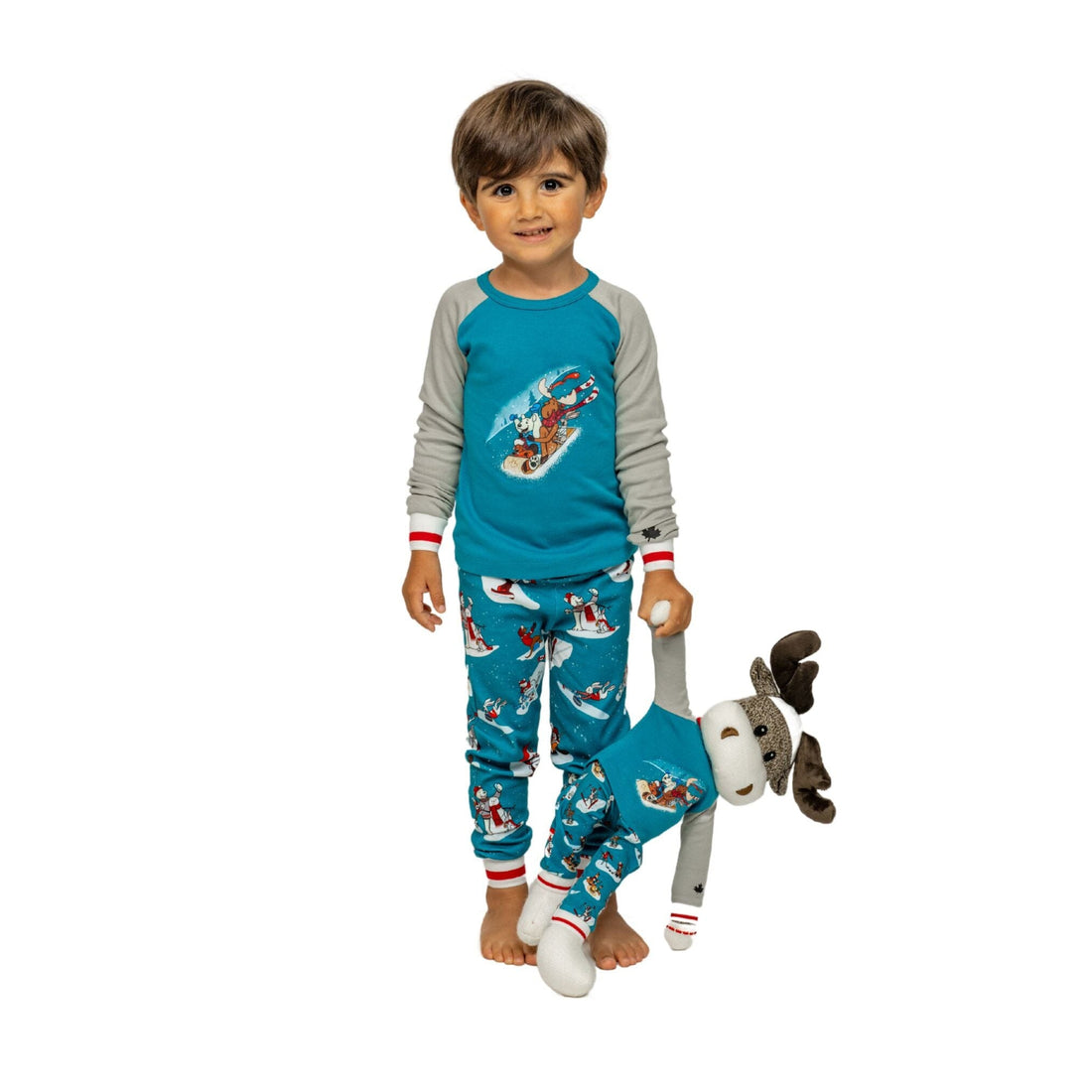 family and 18-inch dolls wearing winter themed pajamas.