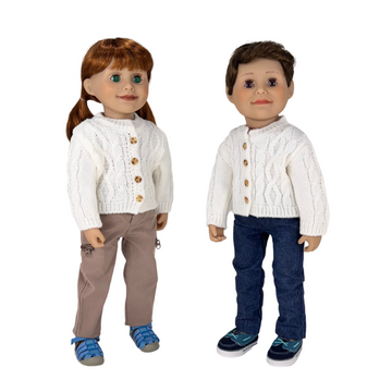 Two dolls wearing white cable-knit sweaters with brown buttons, one in beige pants and blue shoes, the other in blue jeans and black shoes, on a white background.