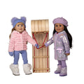 shiny pale lavender puffy coat hat and moon boots on 18-inch girl with sled