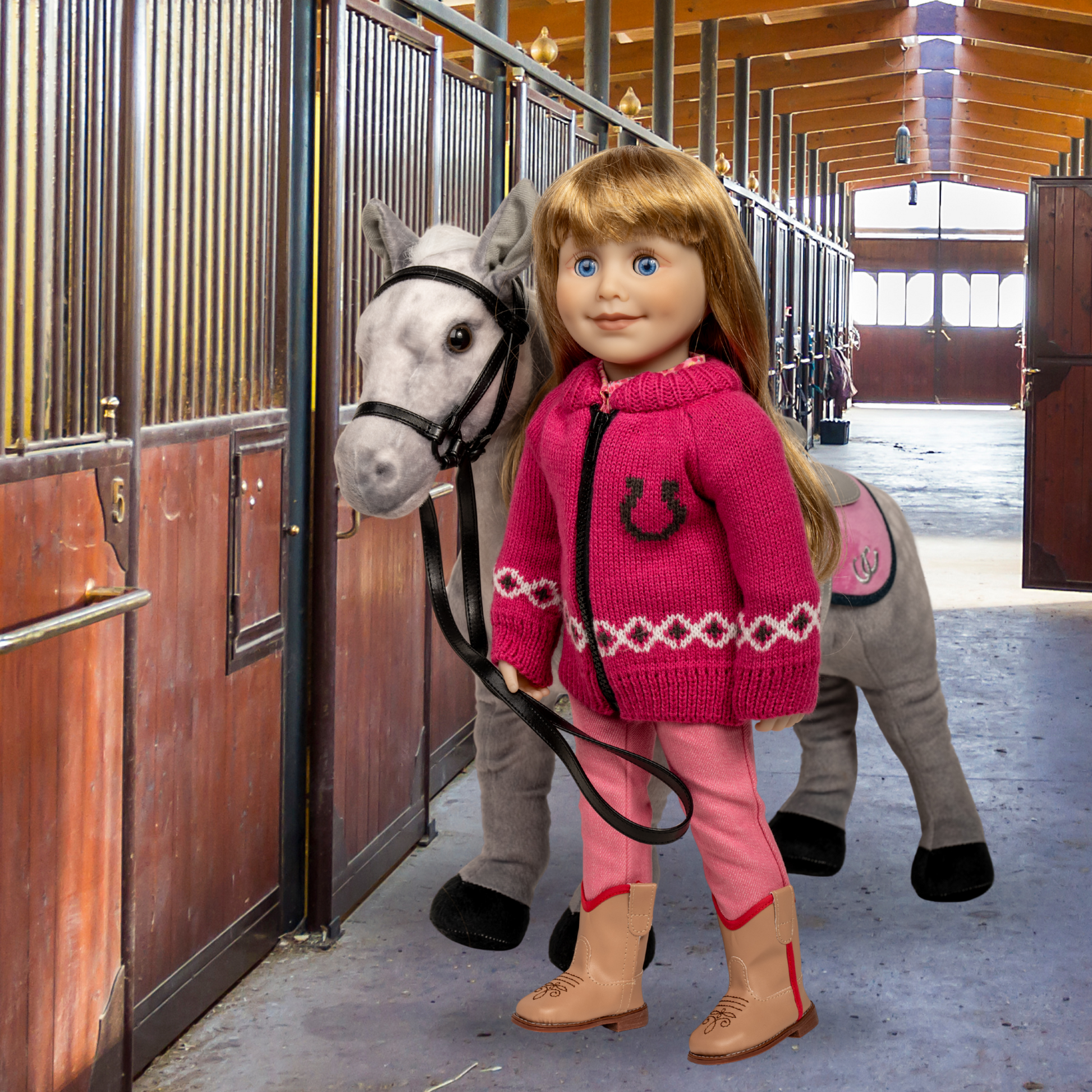 18-inch doll in pink sweater with horse design holding a horse in a stable.