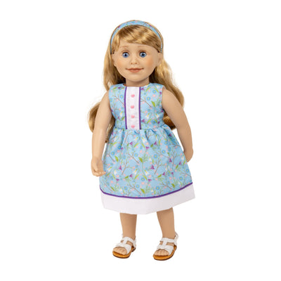 Cute crocus summer dress with headband and white strappy sandals on Maplelea doll