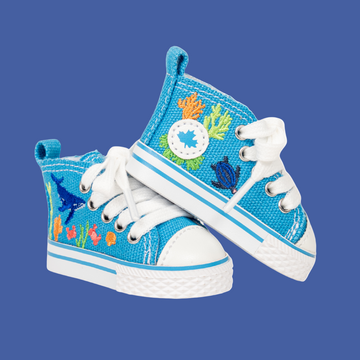 Blue high-top sneakers with ocean-themed design for 18-inch dolls.