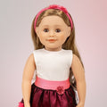 Canadian 18-inch doll wearing dressy outfit with sparkly shoes pink black