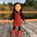 18-inch doll wearing rural roots dress set on a dock