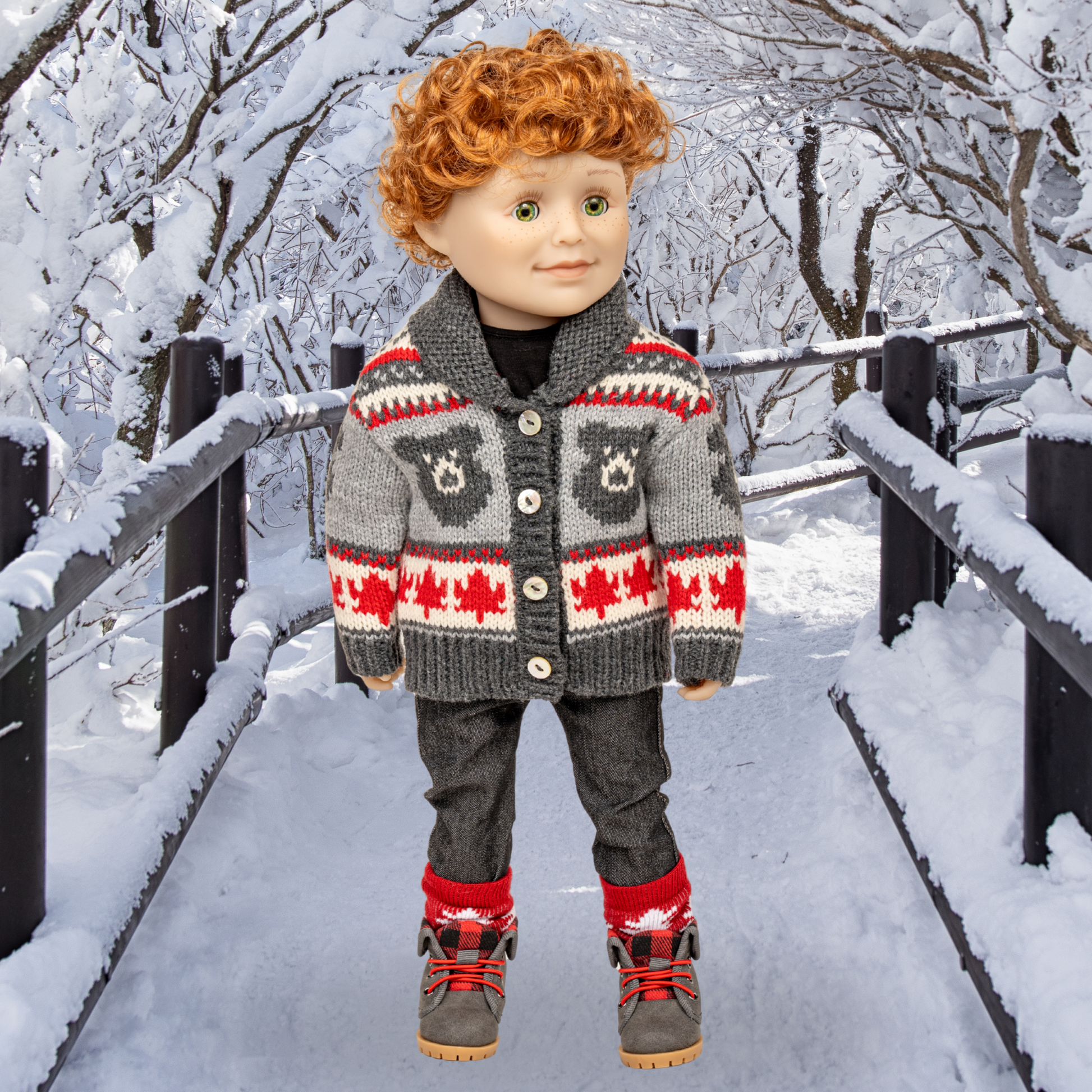 18-inch doll wearing a bear patterned cardigan in a snowy outdoor setting.