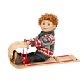 18-inch doll with red hair wearing a bear patterned sweater and sitting on a wooden sled.