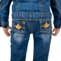 Close-up of blue jeans with embroidered maple leaves on back pockets for 18-inch dolls.