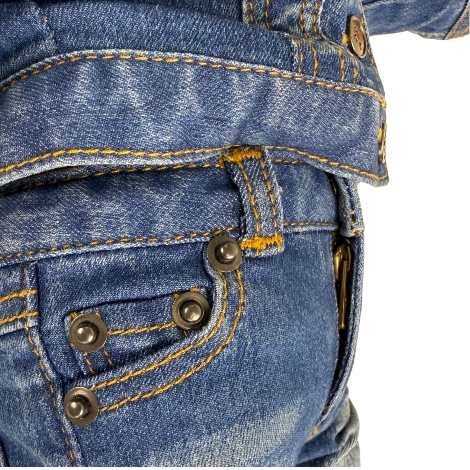 Close-up of blue denim jeans with stitching and buttons for 18-inch dolls.