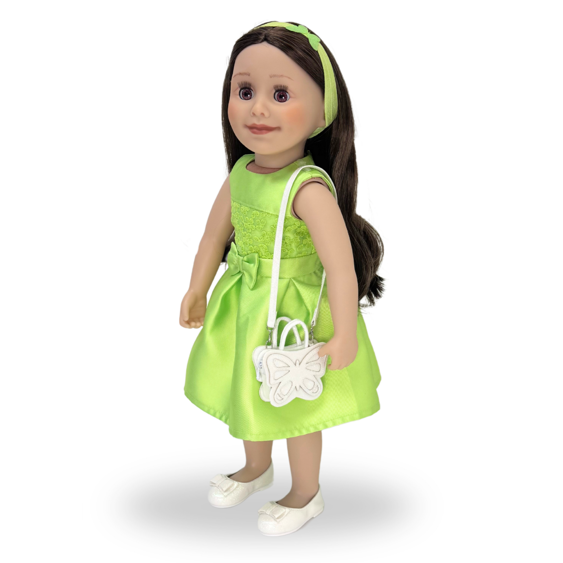 taryn doll wearing green dress and sparkly white butterfly purse.