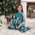 girl and her girl doll wearing matching slippery slope pajamas