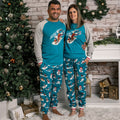 adult man and woman wearing slippery slope pajamas