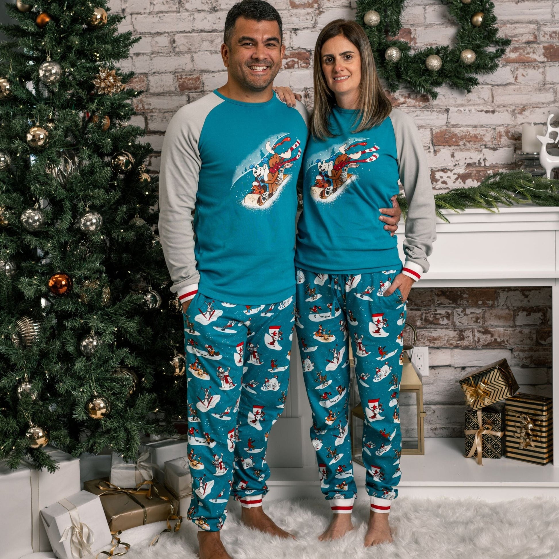 adult man and woman wearing slippery slope pajamas