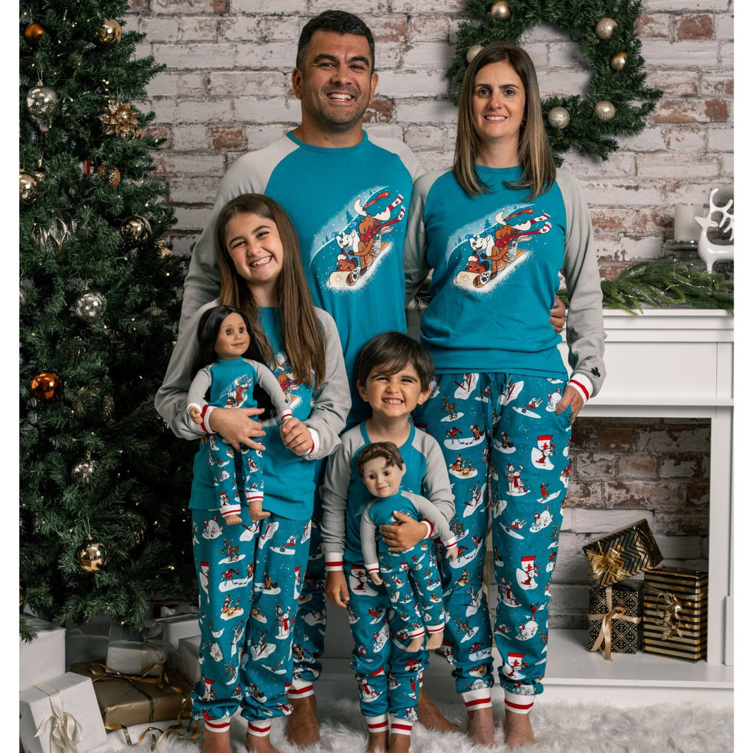 family and 18-inch dolls wearing winter themed pajamas.