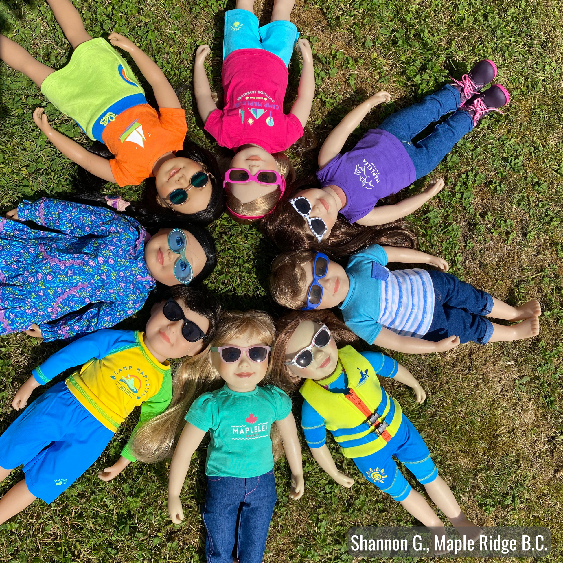 dolls laying in grass all wearing different maplelea sunglasses and glasses