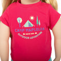 Maplelea doll wearing adventure outdoors bright pink graphic t-shirt.