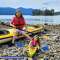 user generated content of girl and her girl doll both in kayaks