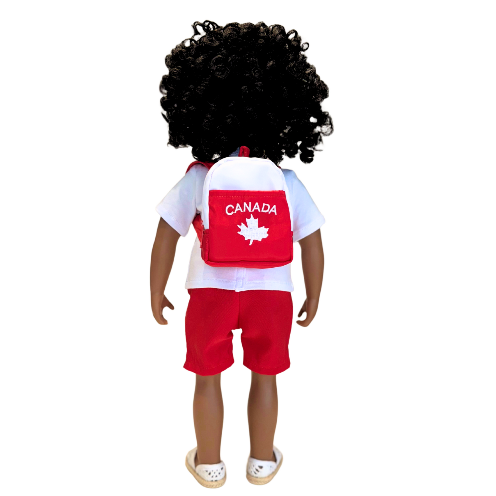 18-inch doll wearing canadian themed red shorts, shirt with true north strong and free emblem, and backpack with embroidered mapleleaf with real zipper and pocket.