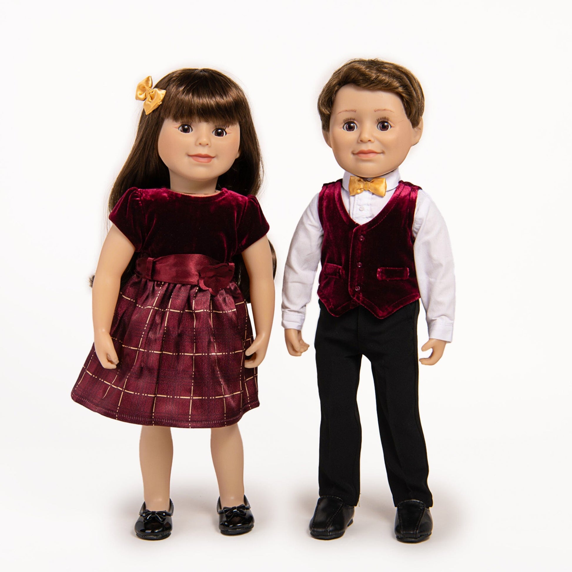 boy and girl doll wearing their festive finery dress and vest sets