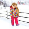 Winter scene with blonde 18 inch girl doll wearing a warm snowsuit and snow pants with boots and mitts on a farm in Manitoba