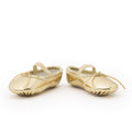 flat image of gold ballet slippers