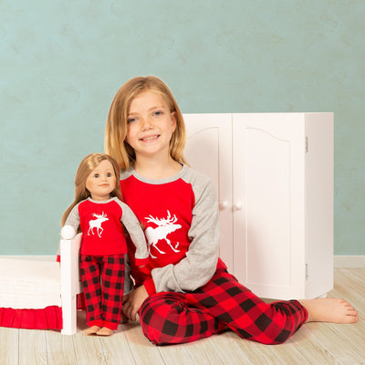 18 inch doll and girl wearing matching Canadian moose pajamas