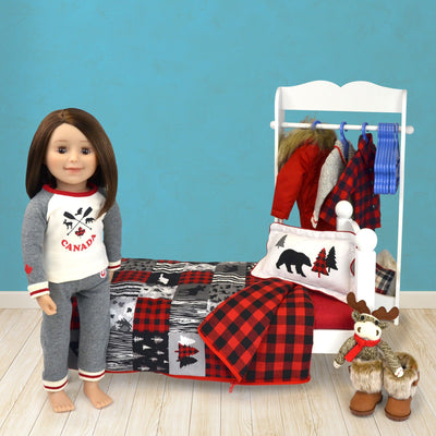 Patchwork style 18" doll comforter set with grey, red and black buffalo plaid and animal silhouettes shown on doll bed with 18" doll and accessories