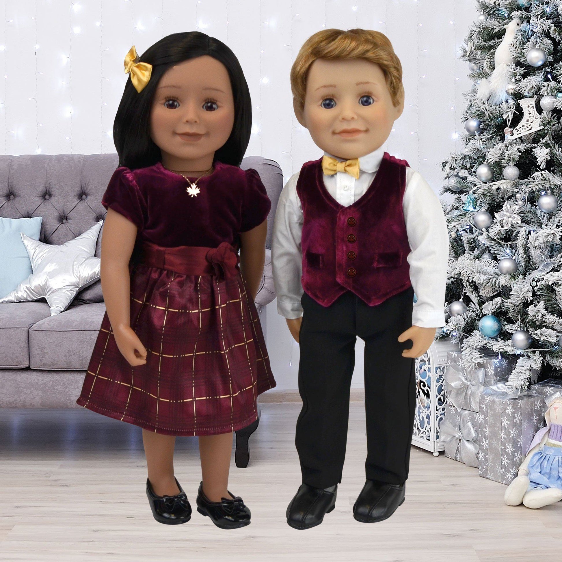 boy and girl doll wearing their festive finery dress and vest set