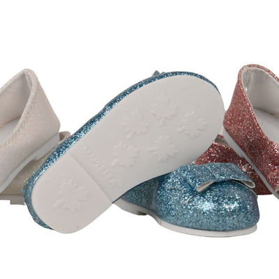 sole of doll shoes has an embossed Maplelea design
