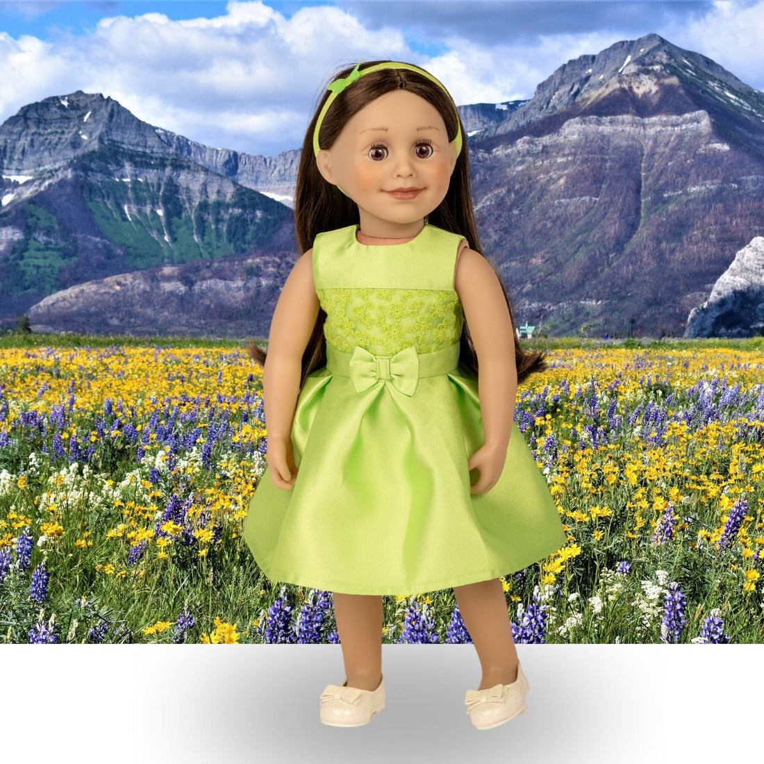 18-inch doll taryn wearing a bright green party dress called the butterfly garden dress set.