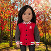 A red and grey varsity jacket worn by an 18-inch doll on a fall background