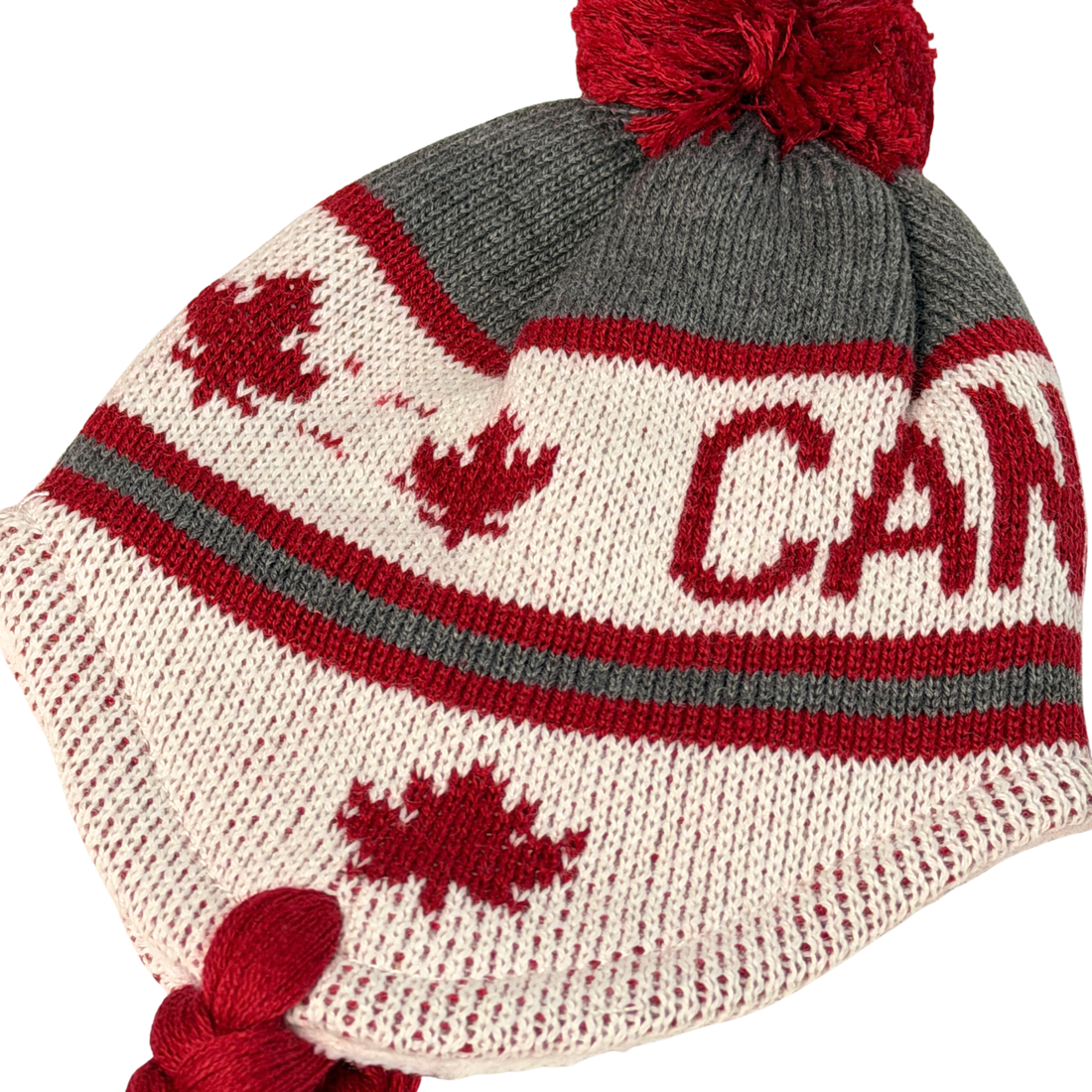 Canadian-themed winter 18-inch doll accessories including a hat, mittens, and socks with maple leaf designs.