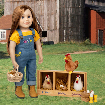 18-inch doll in overalls standing next to a wooden coop with chickens and eggs on a farm setting.