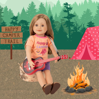 Leonie doll playing Maplelea guitar wearing camp themed short pajamas and brown buckled sandals