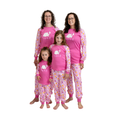 Four women of different ages wearing matching pink long-sleeve pajamas with a white bunny graphic and floral patterned pants, standing together against a plain white background.