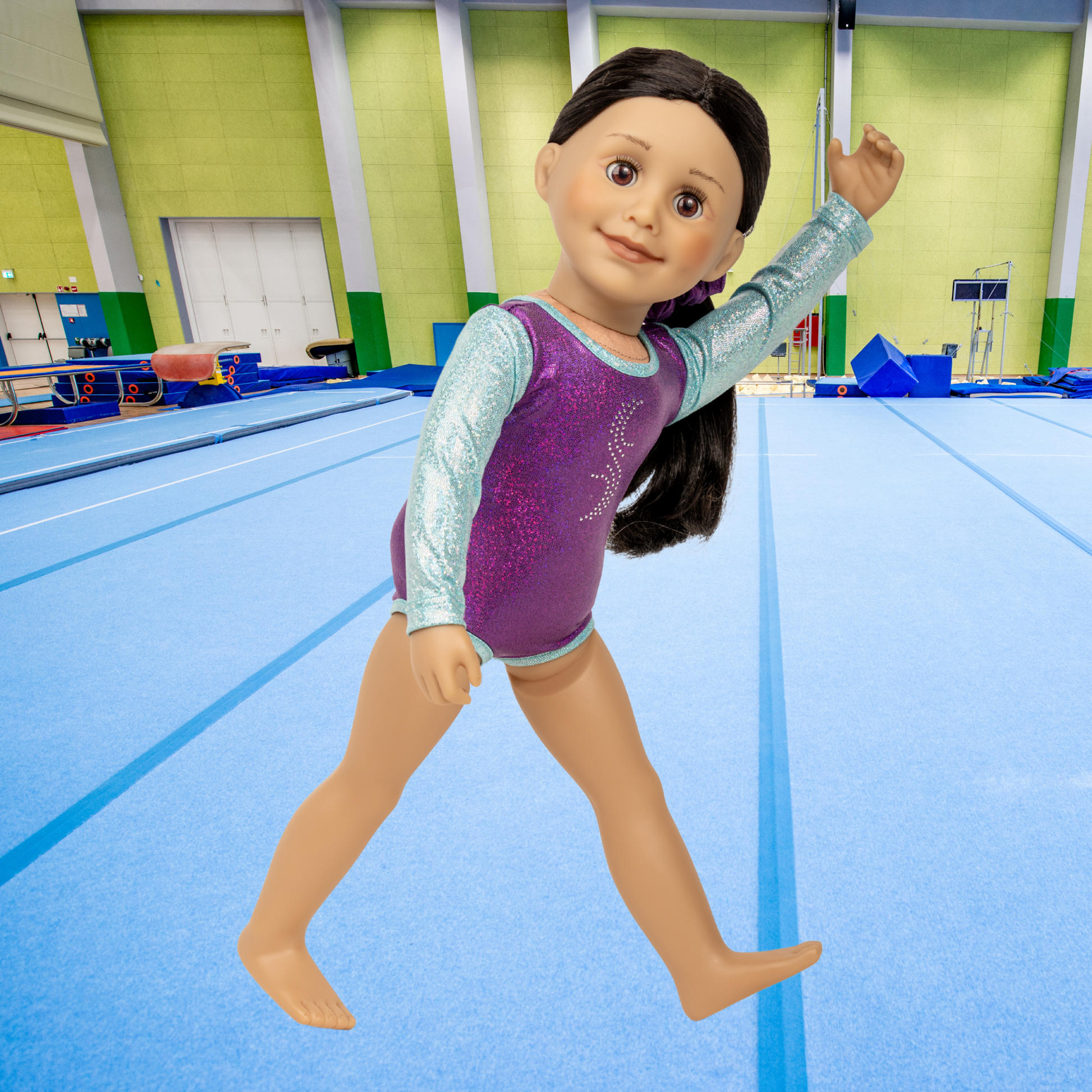 Gymnastics purple and light blue leotard outfit on an 18-inch doll in a gymnasium setting. Maplea