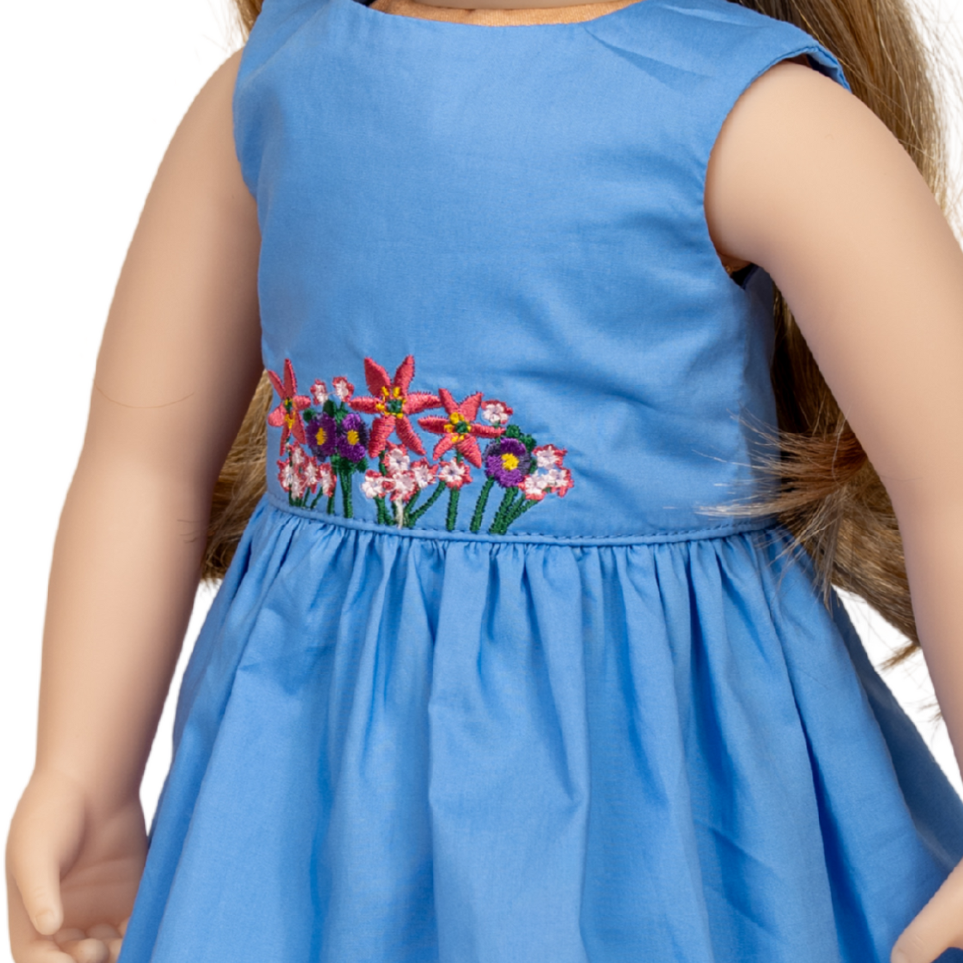 Blue dress with floral embroidery on an 18-inch doll.