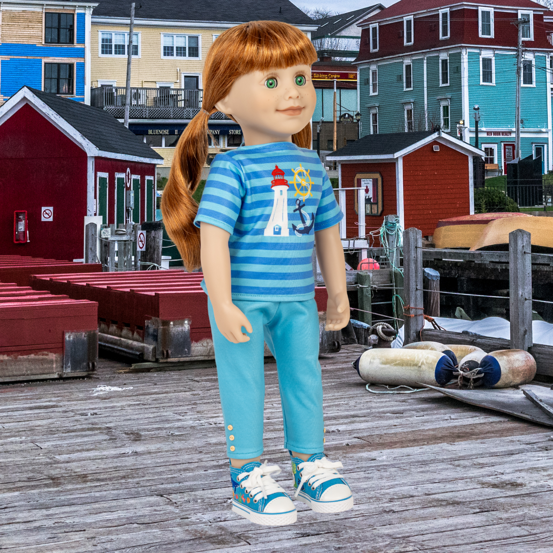 18-inch doll wearing a blue striped shirt with a lighthouse design and matching pants.