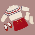 White sweater with cardinal pattern, red skirt with gold buttons, red shoes, and white socks for 18-inch dolls.