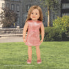 Maplelea 18-inch doll wearing sparkly pink dress with bow belt matching shoes and bracelet