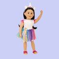 18 inch doll wearing a unicorn outfit of white body suit, multicolour tutu and a unicorn headband