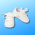 White runners in a classic tennis style fit all 18