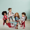 Maplelea dolls with pajamas on lounge chair with pillows blankets