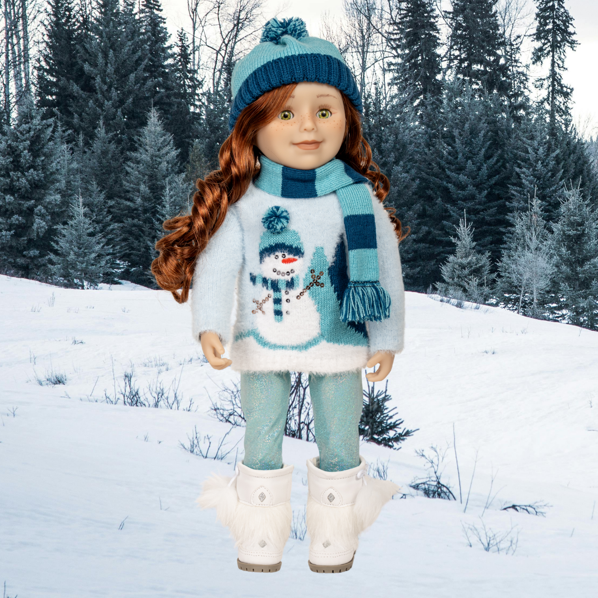 Doll wearing a winter outfit with a snowman sweater, blue hat, and scarf, with winter boots and sparkly leggings.