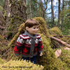 boy doll wearing bulky knit sweater with mountain design and maple leaves