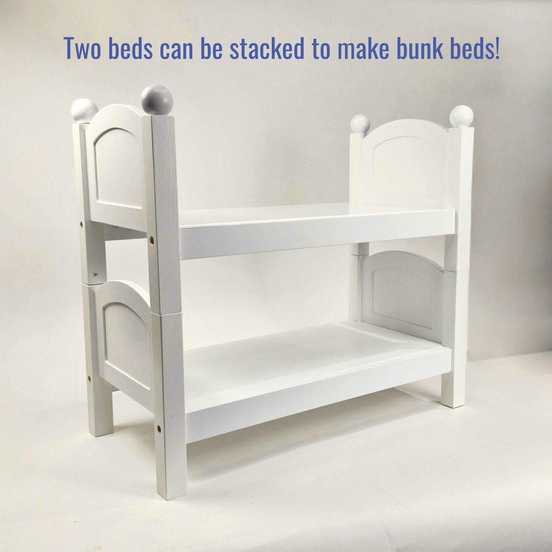 White wooden doll bed for 18 inch dolls.  Part of Maplelea's doll furniture collection.