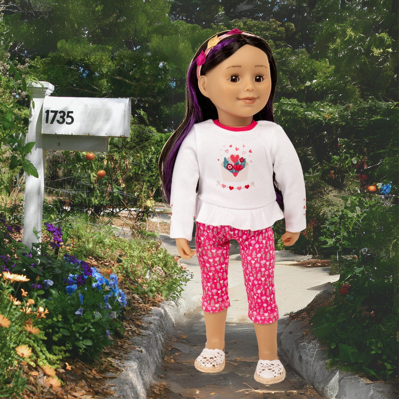18" Maplelea doll wearing cute peblum top with pink leggings heart hairband and lace sandals