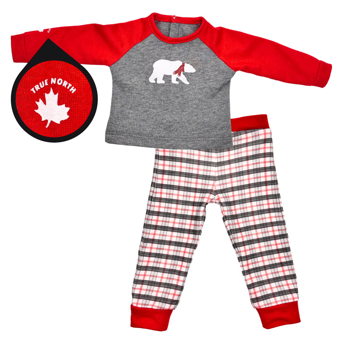 Two dolls wearing matching red and grey plaid polar bear pajamas.